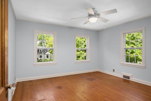 The carpet has been removed from the third bedroom.