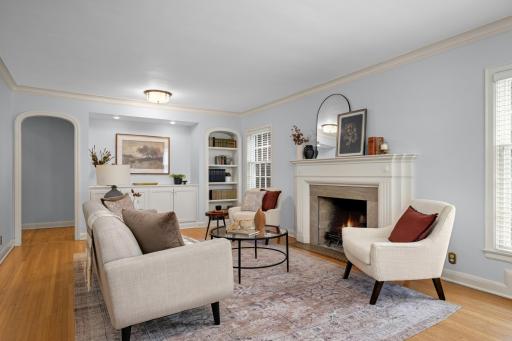 Formal living room with wood-burning fireplace.