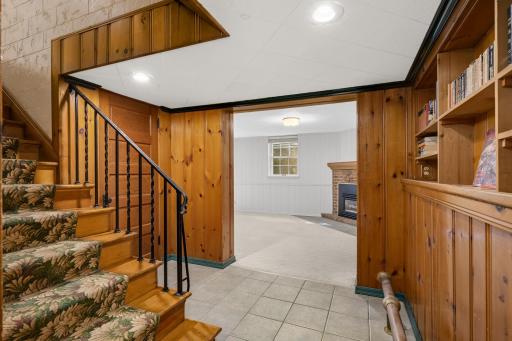 The lower level with beautiful knotty pine paneling.