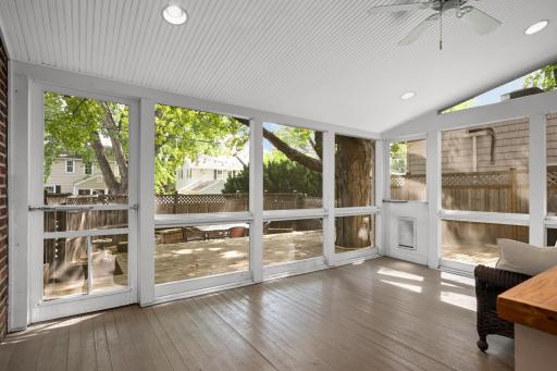 Vaulted beadboard ceiling with recessed lights and fan.