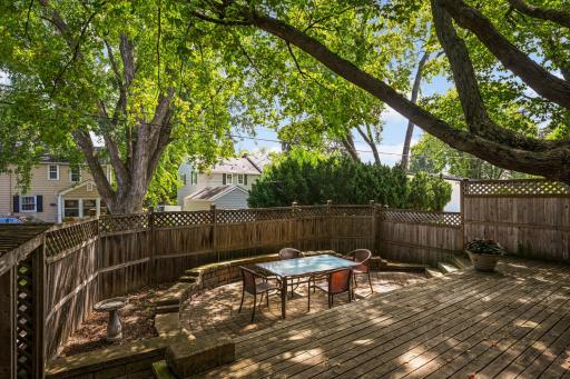 The fenced yard includes a deck...
