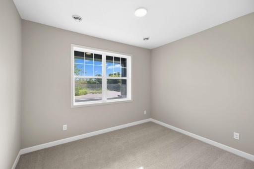 Two secondary bedrooms provide personal space and privacy away from the bustling main living areas, as well as a location adjacent to the full-sized bathroom for optimal convenience.