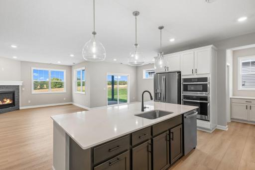 The flowing layout of this kitchen allows residents to easily access the extensive cabinetry space and a nearby butlerâs pantry