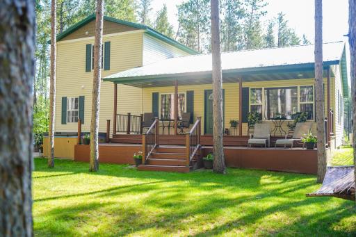 Back with Large Covered Deck & Patio with a Hot Tub