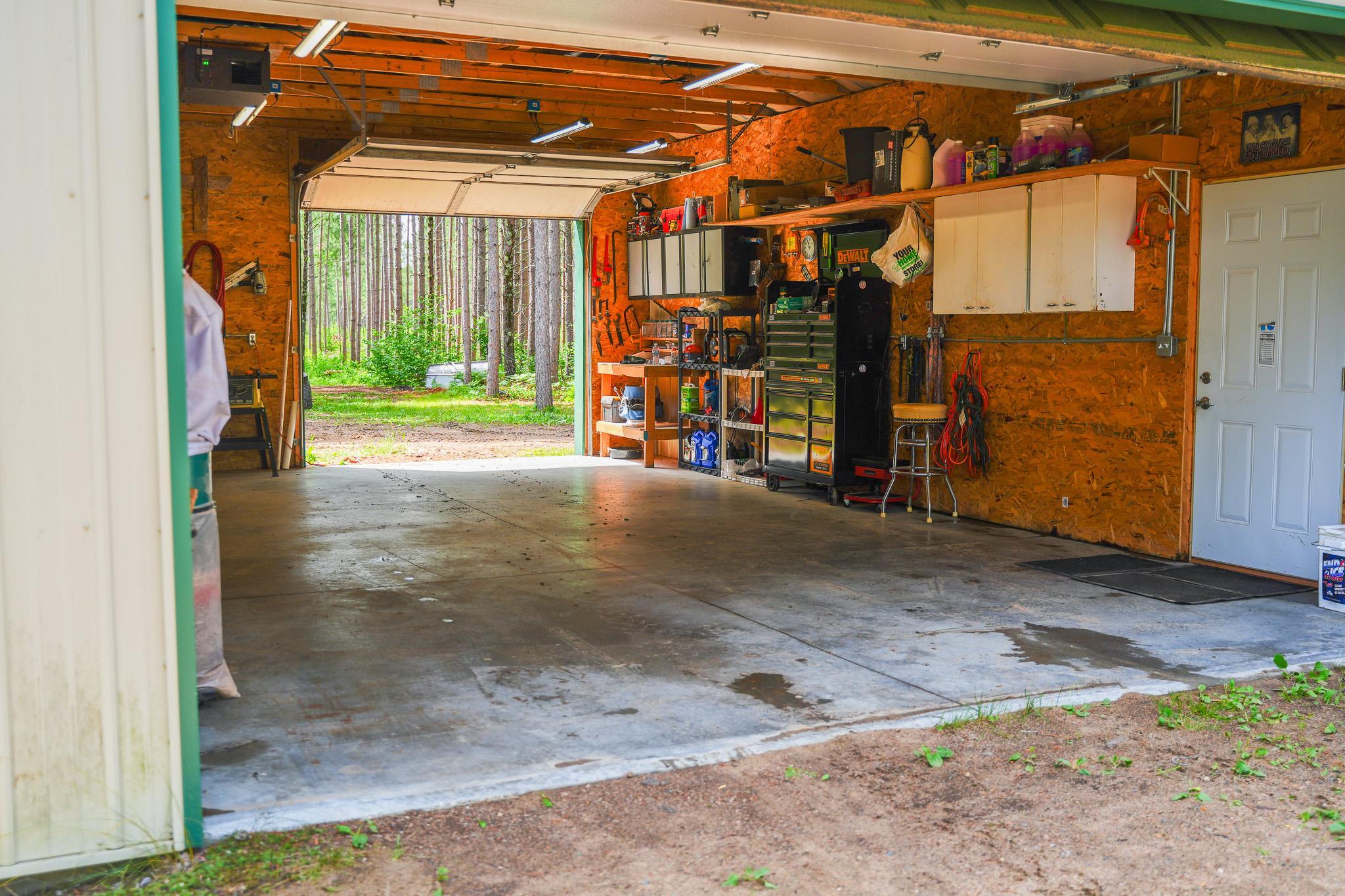Insulated, OSB interior, LED lighting, 100 amp circuit breaker, 16x9 overhead door in front and 9x9 overhead door in back