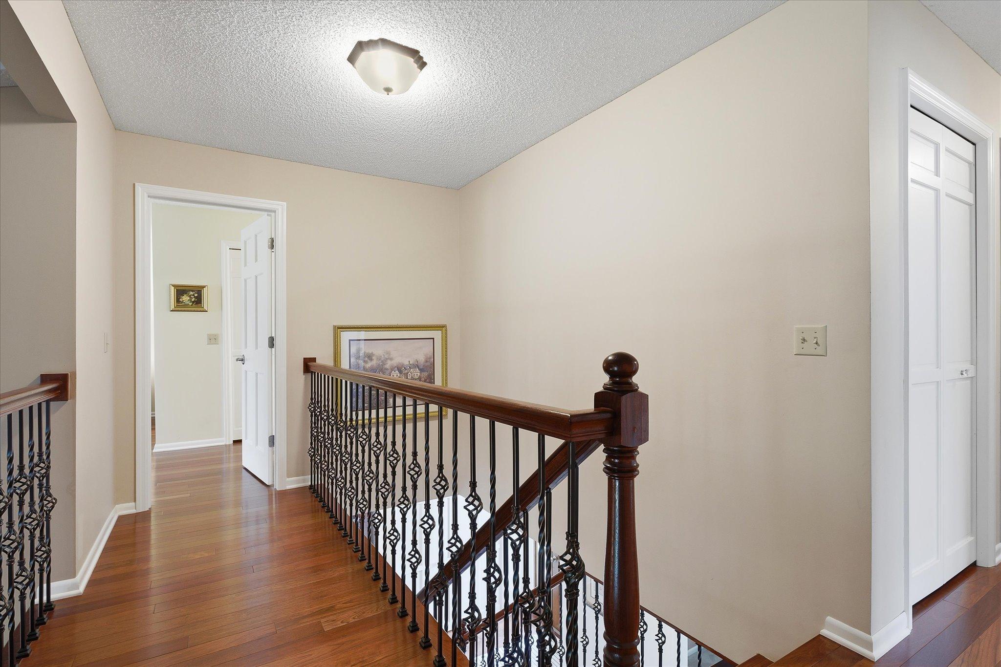 Lovely red cherry wood flooring continues throughout the upstairs of this home.
