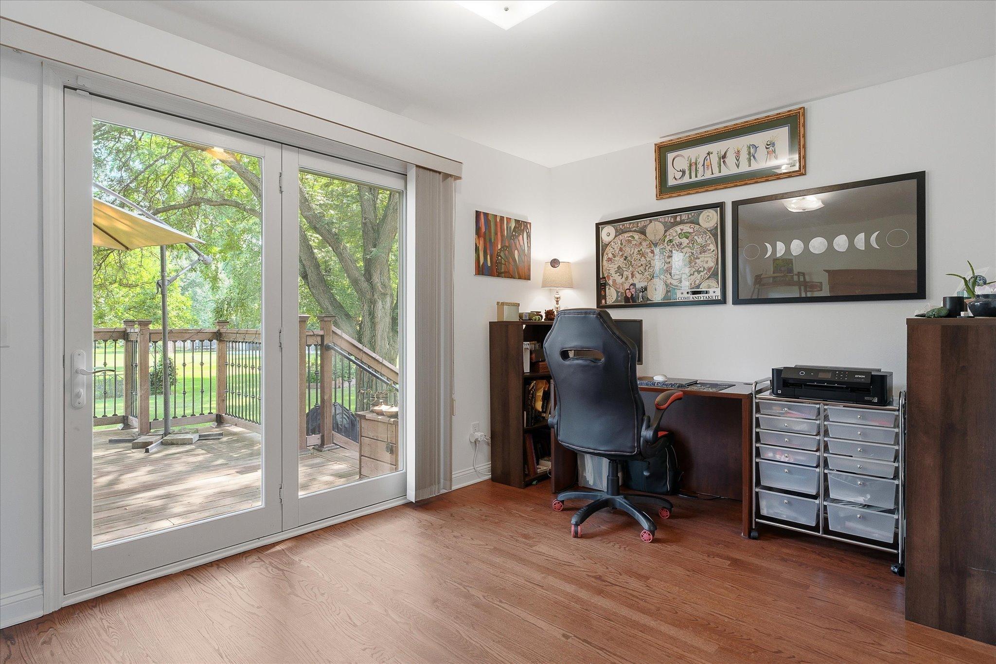 Separate den with access to the back deck.
