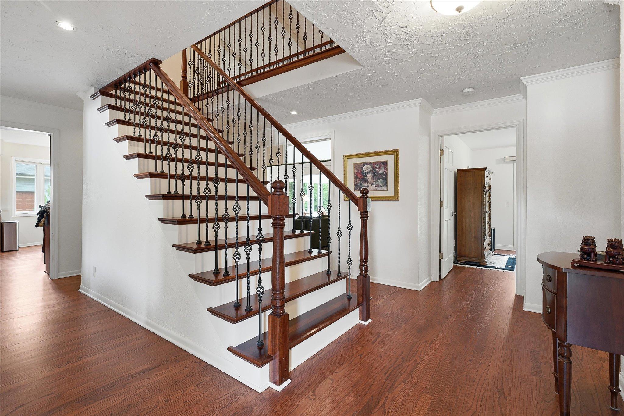 Welcoming grand stairway with open site lines.