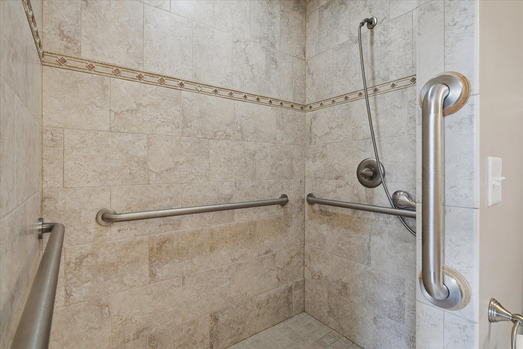 Large walk-in tiled shower.