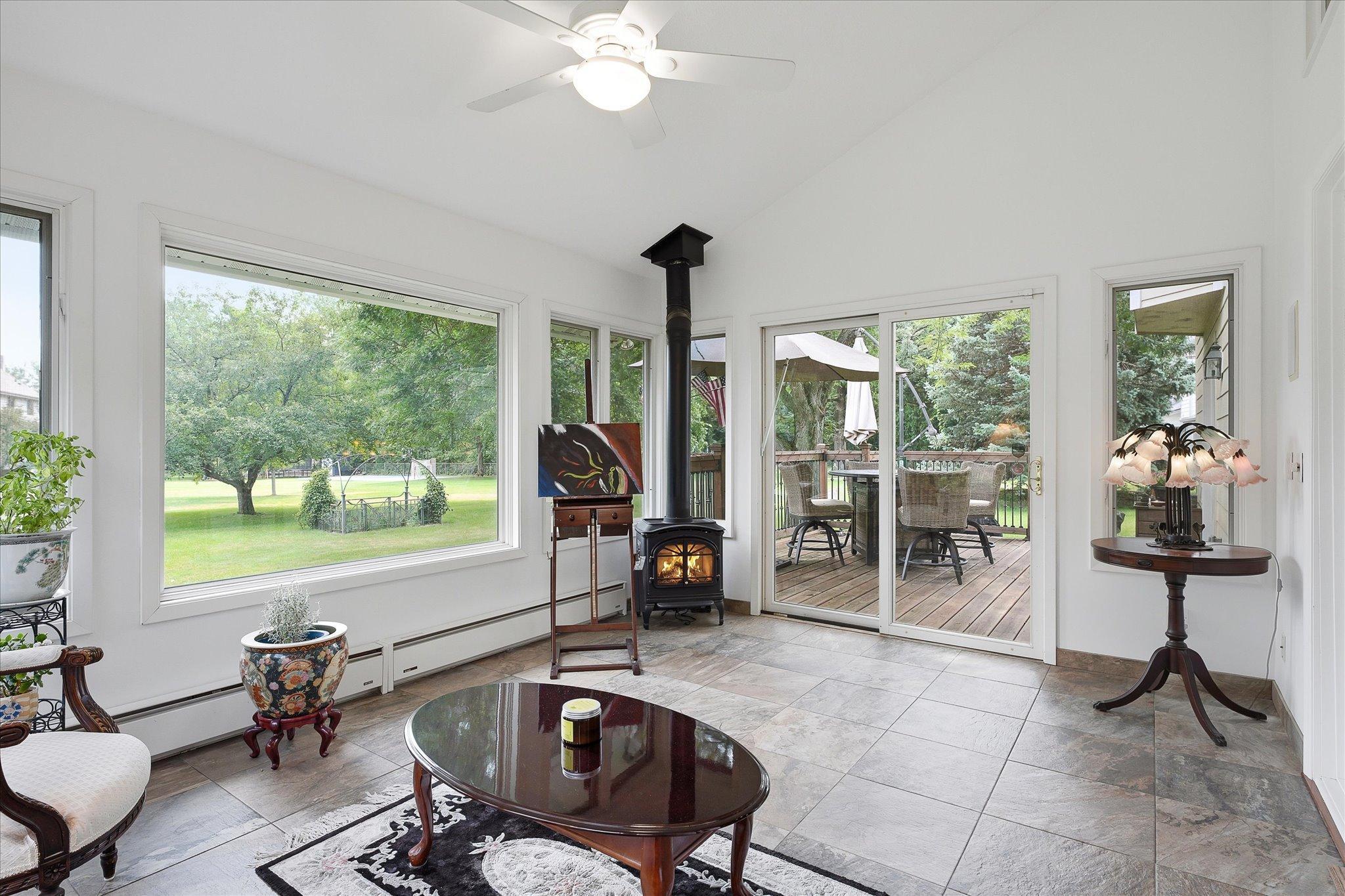 Sliding doors to the right of the sunroom lead to the ouside deck.