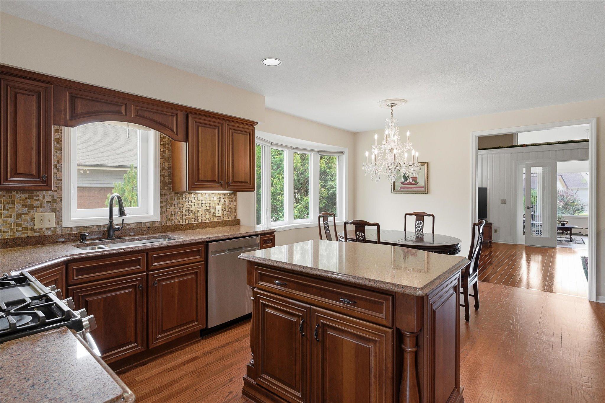 Solid wood cabinetry with extra storage and lovely countertops.