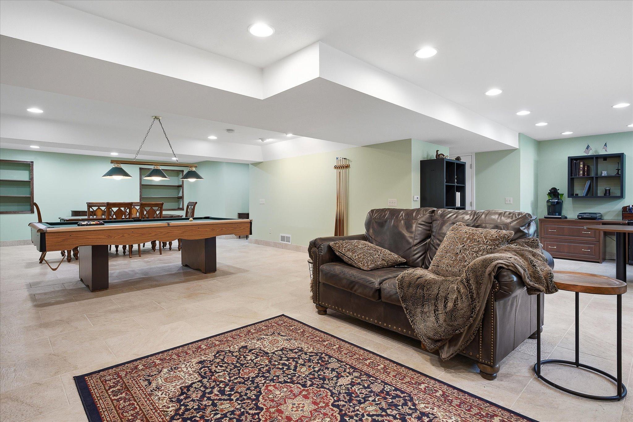 Sleek recessed lighting throughout the basement.