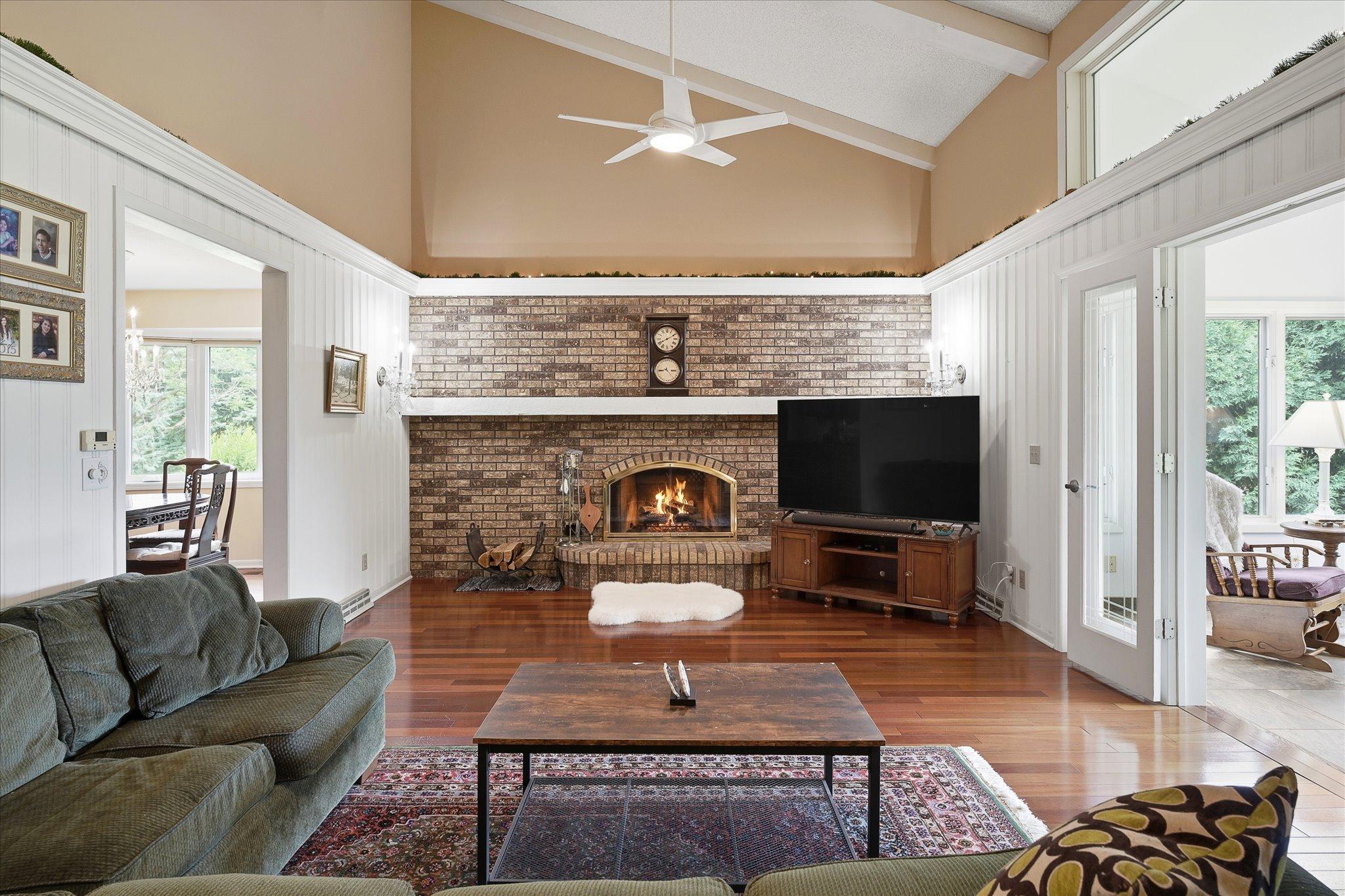 Large brick fireplace provides warm and inviting ambiance.