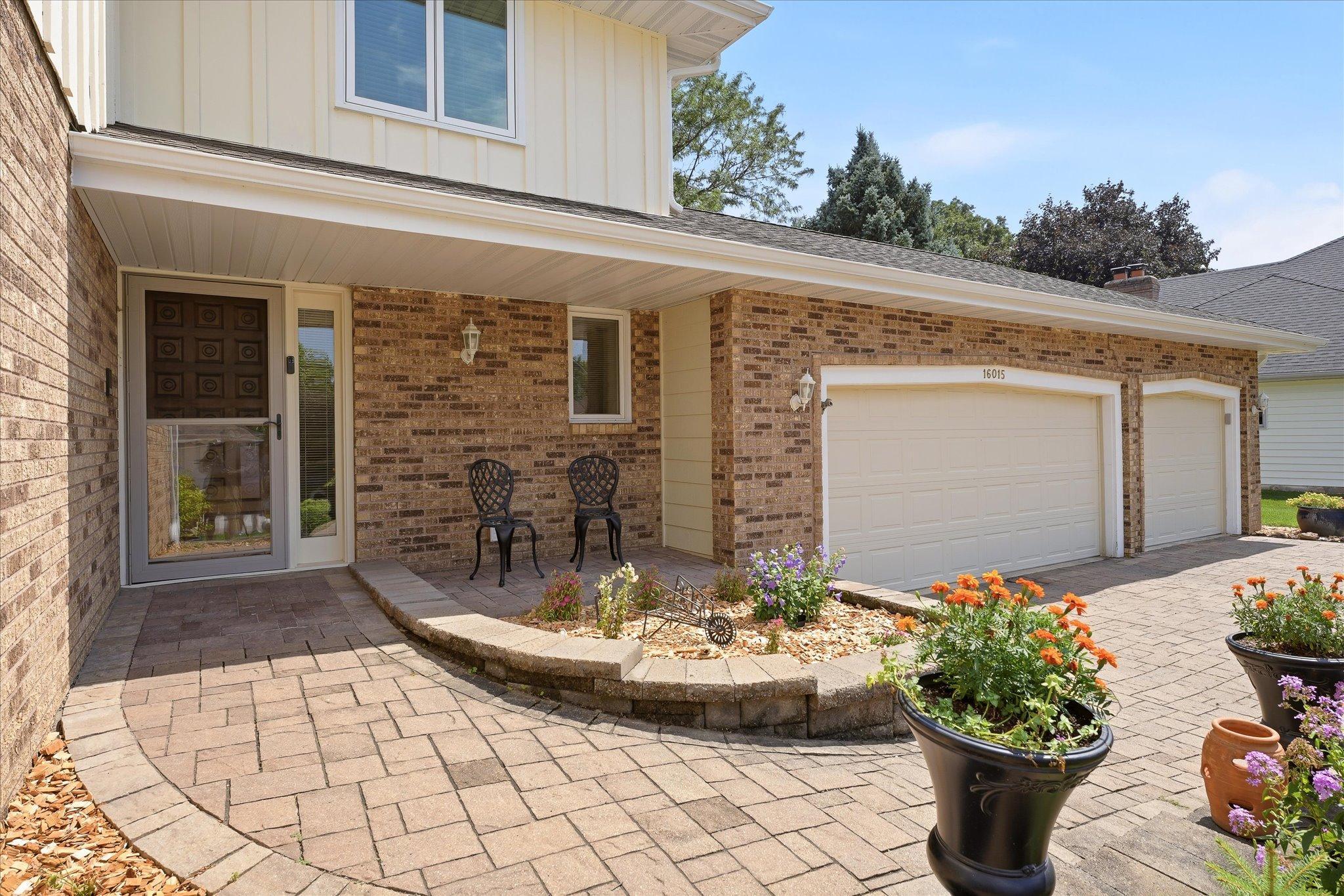 Large paver walkway invites you in.