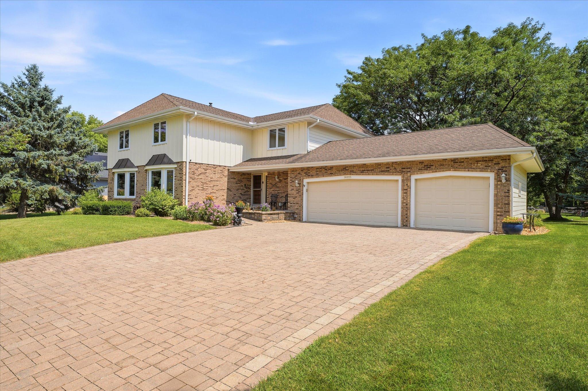 Paver driveway is just one of the many upgrades in this home.