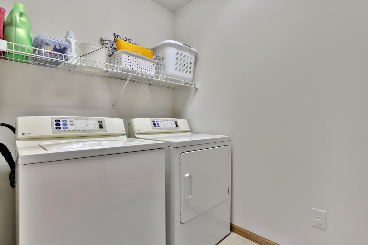 Laundry with shelving.