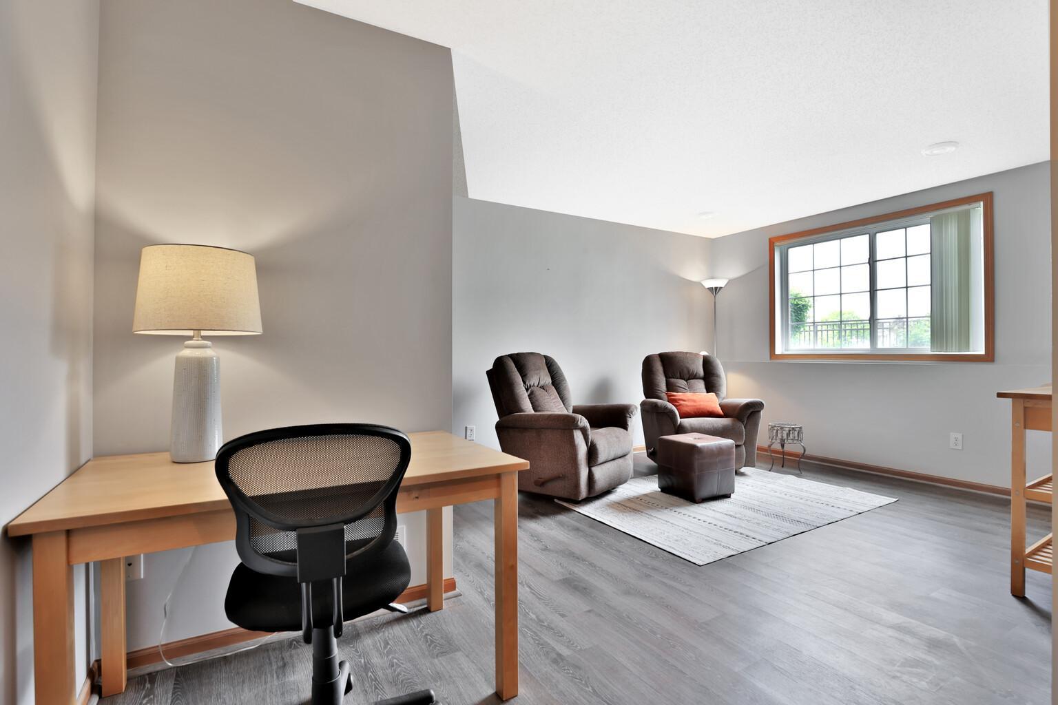 Office desk and television room with look out windows on the lowest level.
