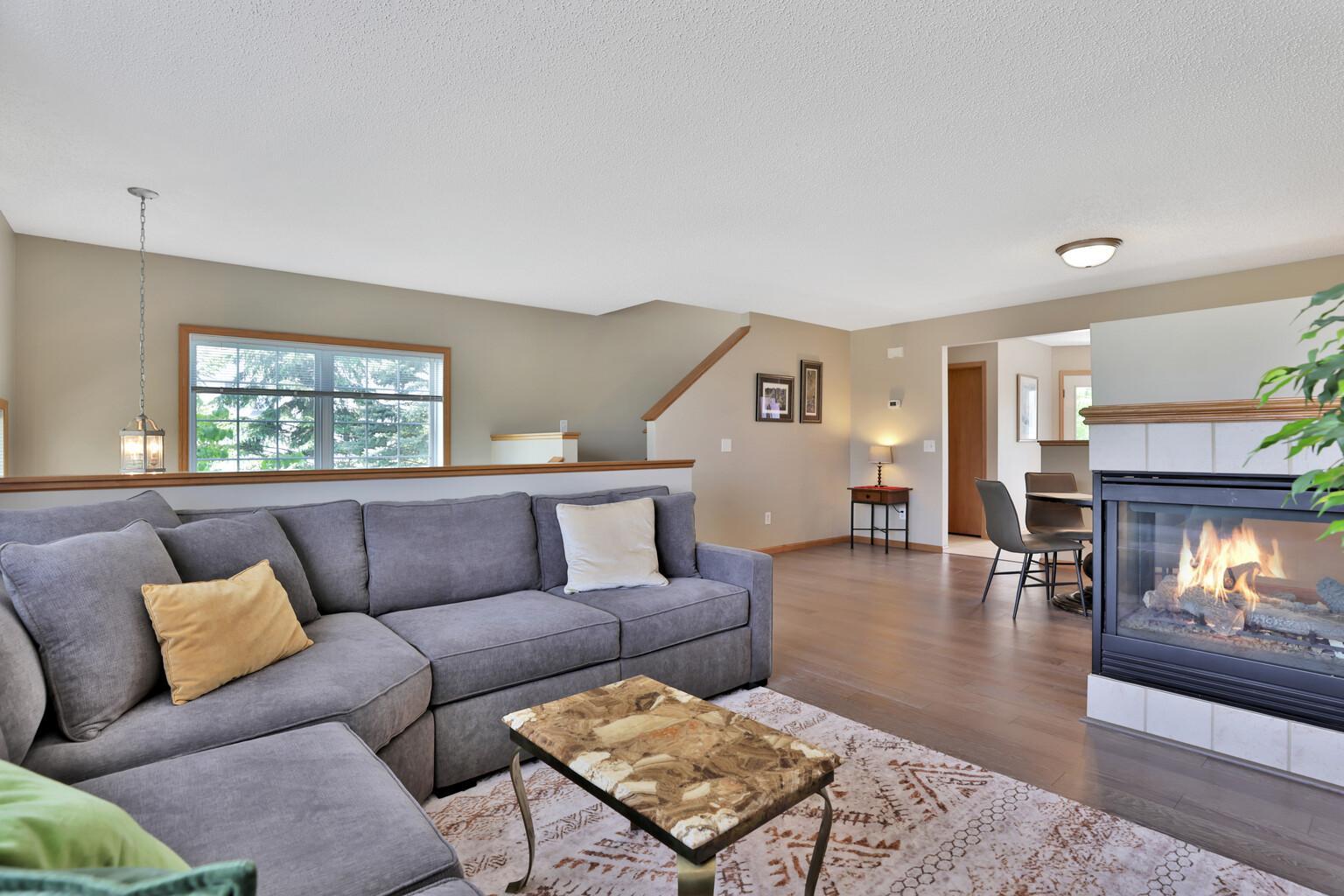 View of the dining and kitchen area and stairway to upper level bedrooms.