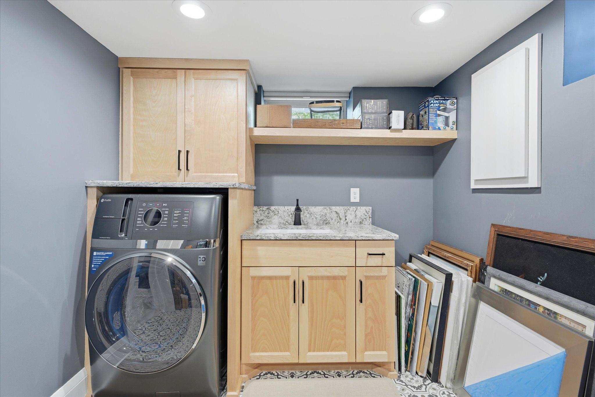 Newer washer/dryer combo in the laundry room