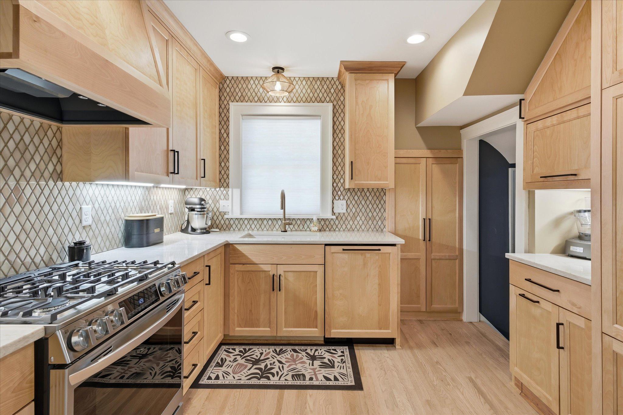 New kitchen with custom cabinets, soft close drawers and doors, hardwood floors