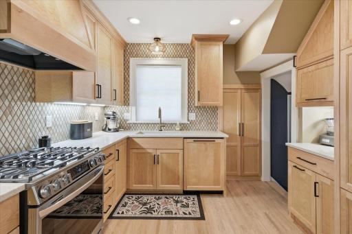 New kitchen with custom cabinets, soft close drawers and doors, hardwood floors