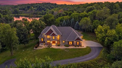 Situated on a private, wooded lot overlooking one of the serene ponds in the highly sought-after Indigo Ponds neighborhood, this stunning 5 bed, 4 bath home showcases refined craftsmanship and exceptional design.