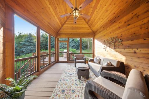 Enjoy peaceful mornings from the cedar-lined screened porch, or relax on the expansive deck.