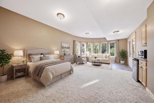 A fifth bedroom with private outdoor access offers endless flexibility for guests, hobbies, or a home office. (virtually staged)