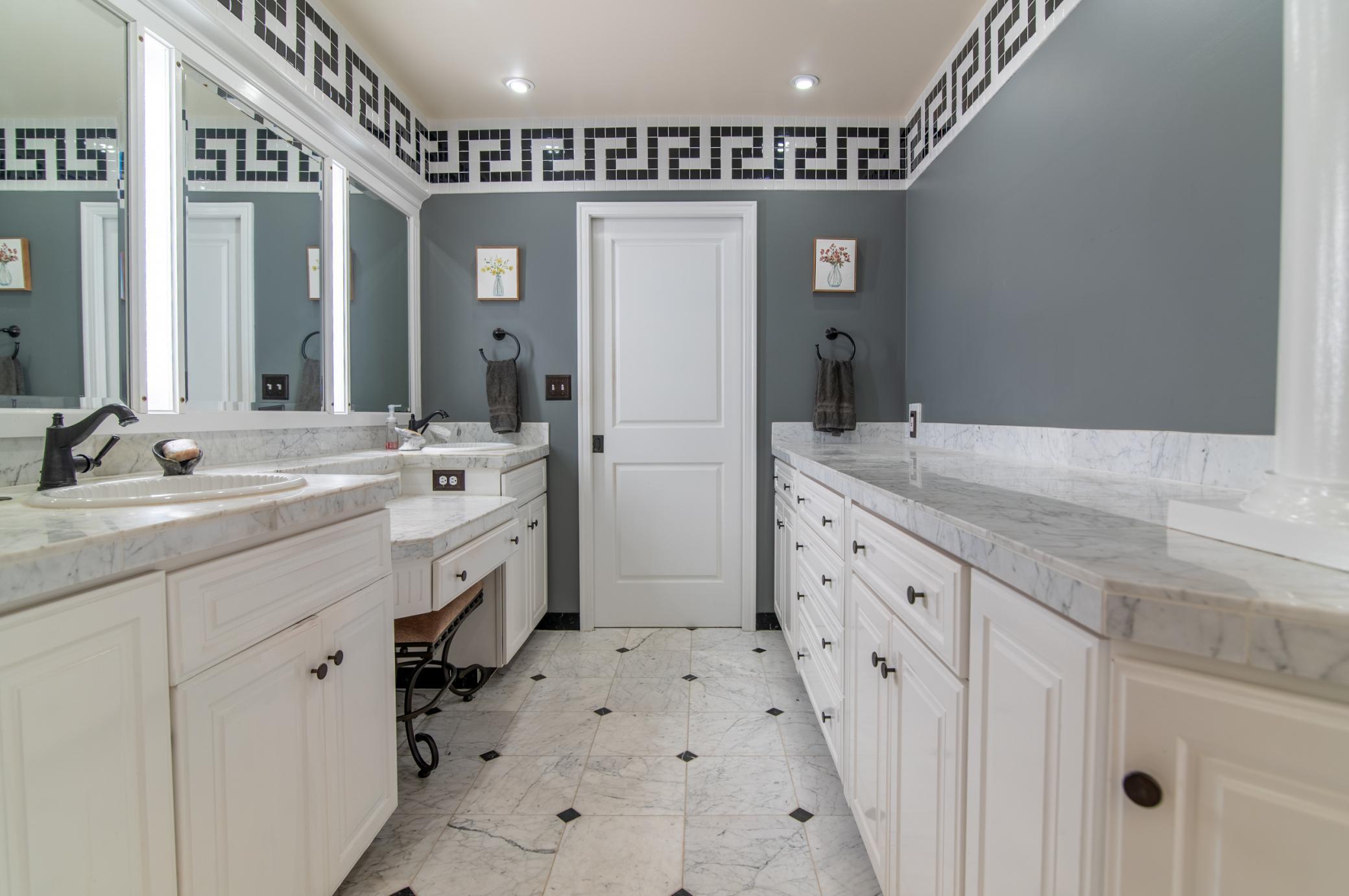 Twin sinks and loads of counter space are perfect for sharing or just spreading out to get yourself ready.