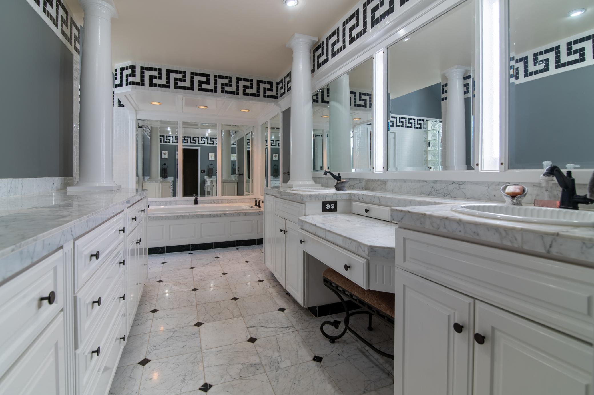 Stepping into this bathroom makes anyone immediately feel pampered. Loads of counterspace and plentiful mirrors make sure you look your best before heading out the door.