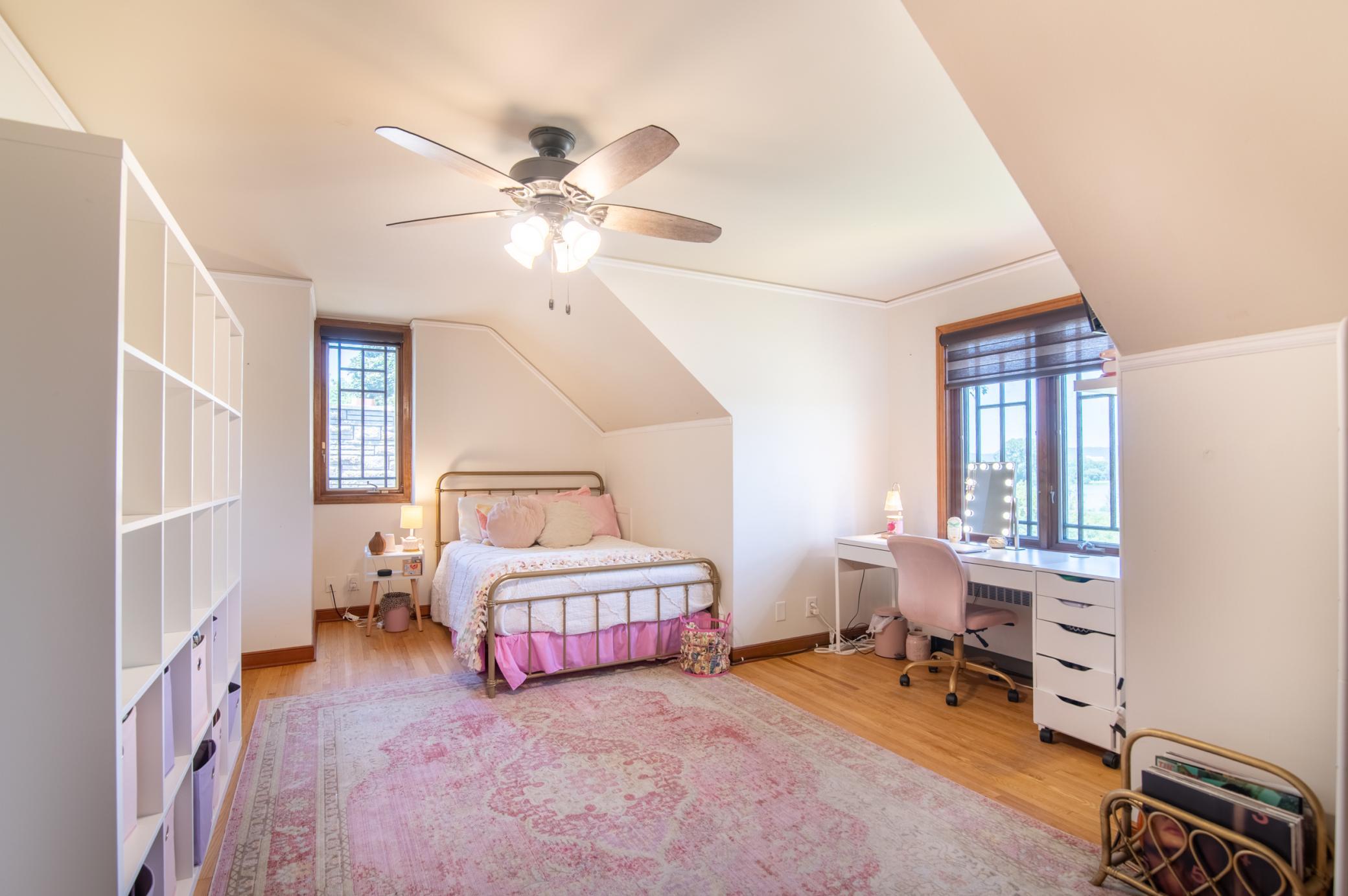 One of four bedrooms upstairs, this room is big enough to be configured in many ways and overlooks the sprawling front yard and nearby Lake Winona.
