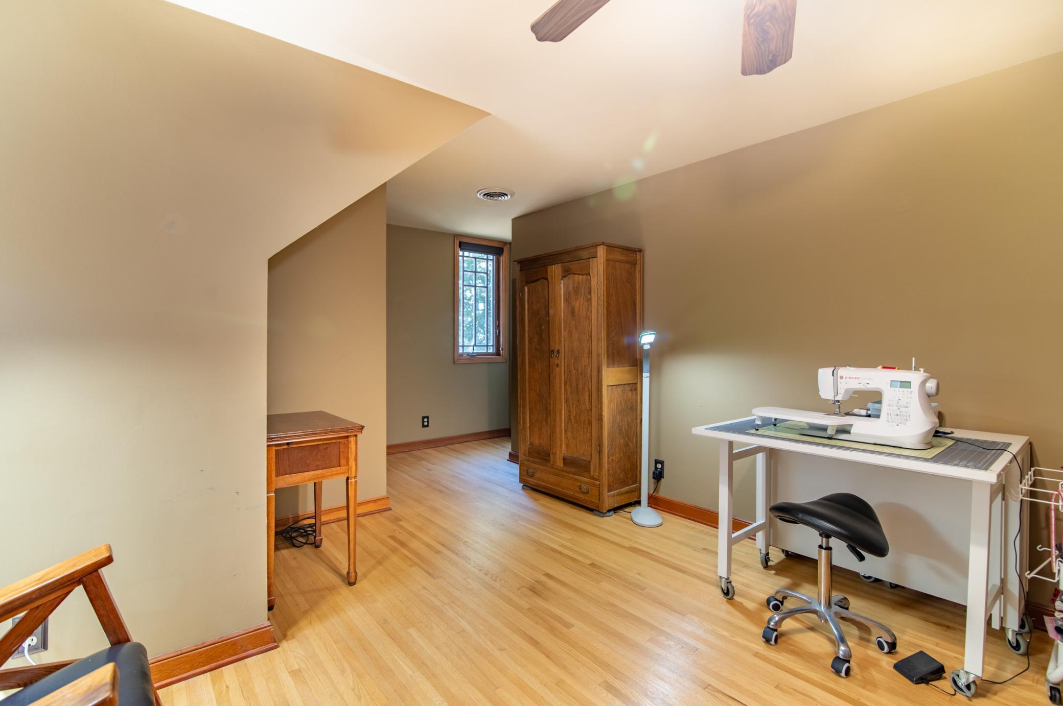Currently used as a hobby / craft room, this is the fourth bedroom on the upper level and would be great as a private office retreat or a quiet sleeping room. Windows on two sides overlook the backyard.