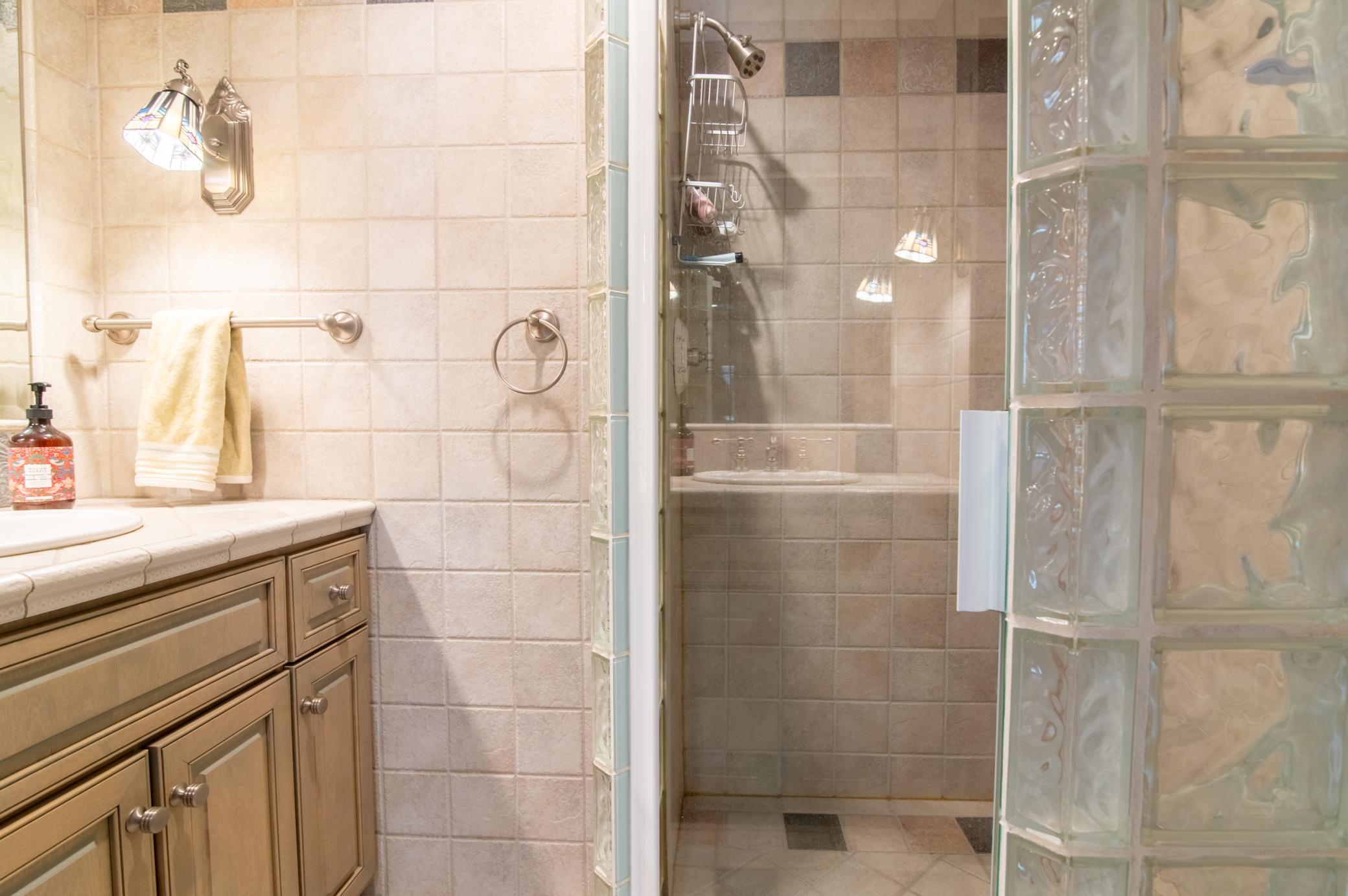 This 3/4 bath sits just off the family room and is perfect for rinsing off after a swim.
