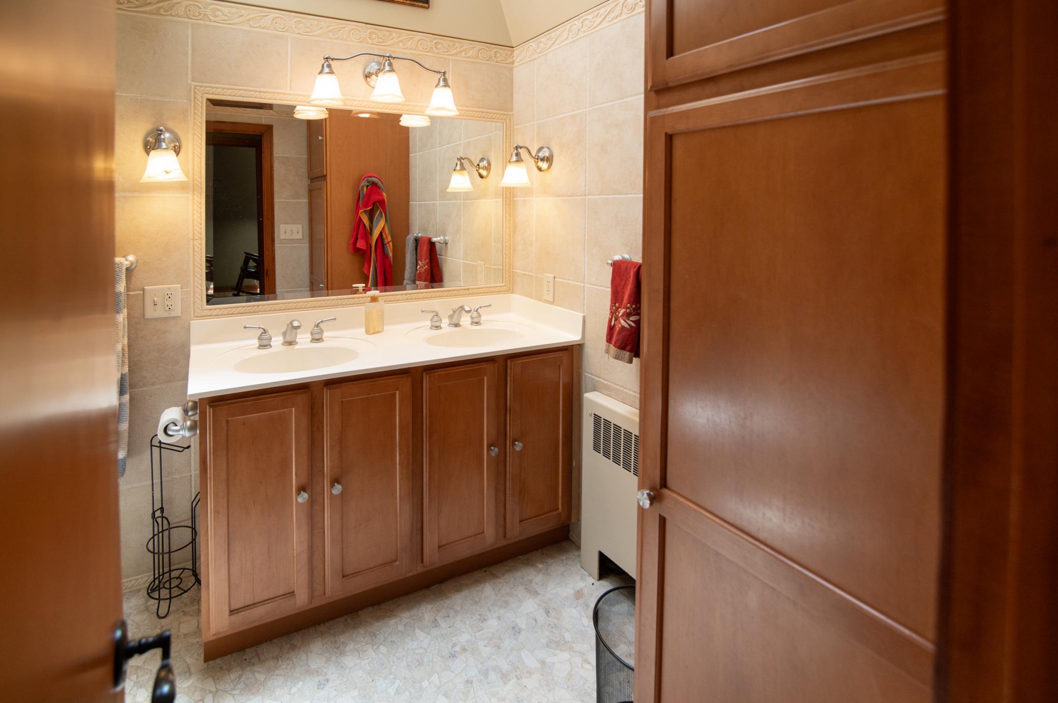 Even the smaller baths have room in the form of double sinks and storage space.