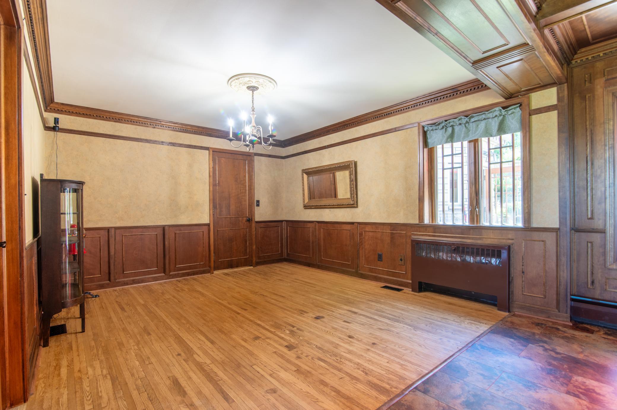 Beautiful wainscoting and crown moulding give this dining area a traditional feel that is perfect for hosting thanksgiving dinner or other holiday meals.