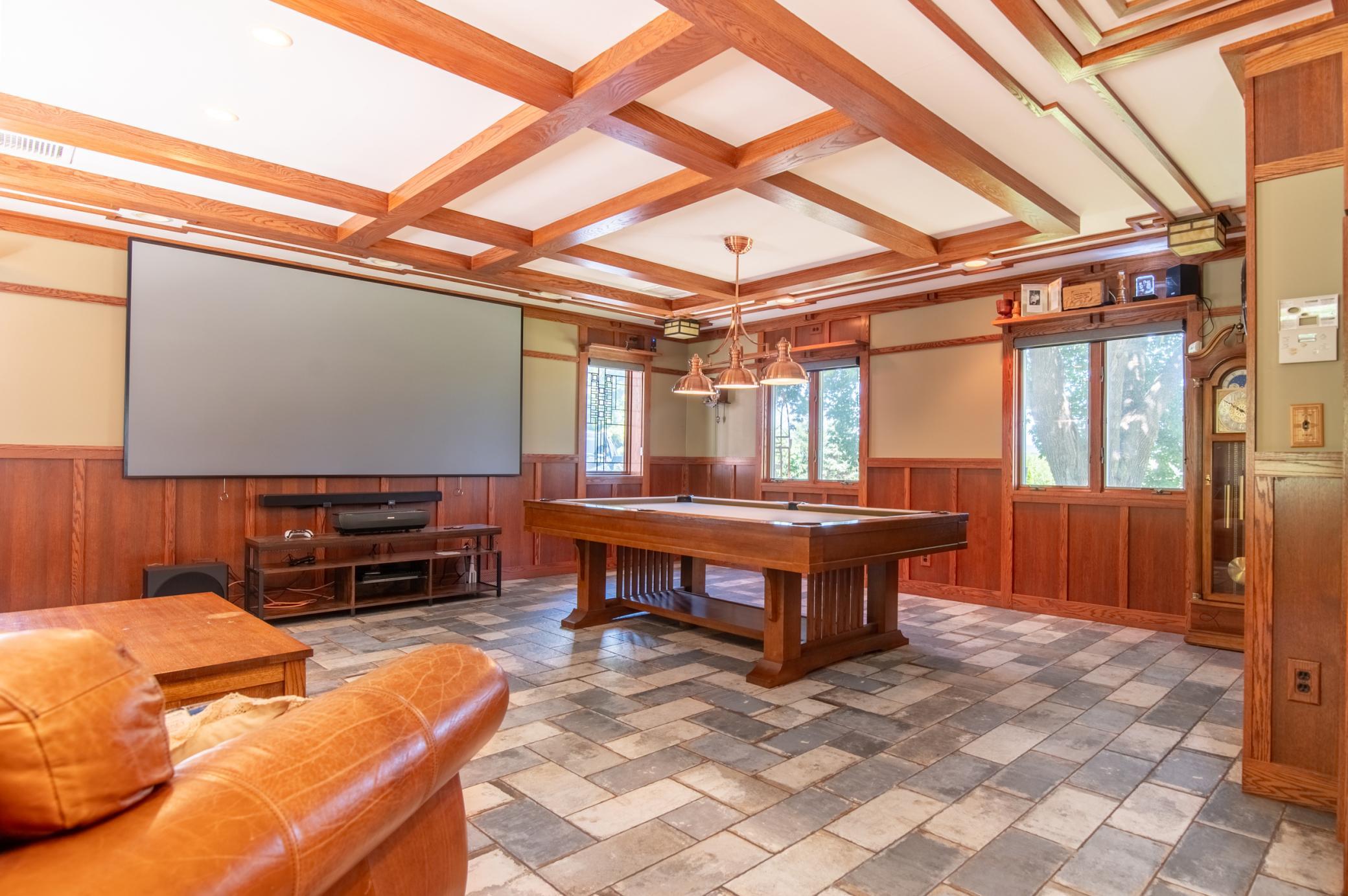 At the far end of the home, the family room is perfect for movies, games, or taking a break from the swimming pool.