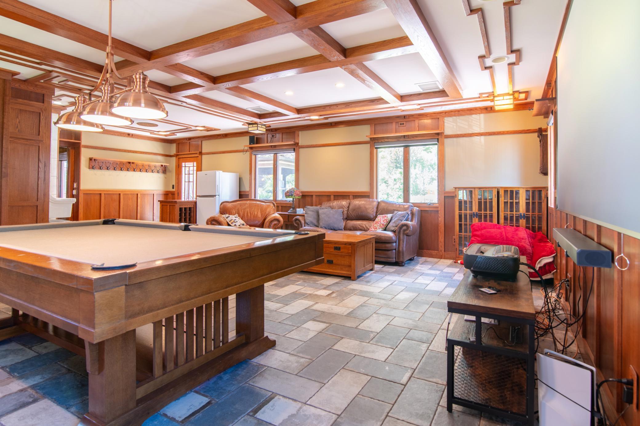 Complete with pool table, this family room is a comfortable and spacious hangout.