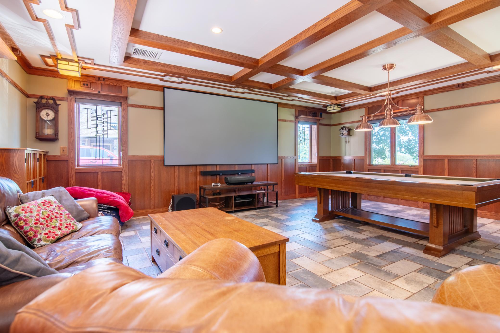The tile below is framed to reflect the coffered ceiling elements above in this room, elevating the space.