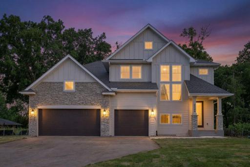 Evening twilight view of the property, offering a warm and inviting ambiance.