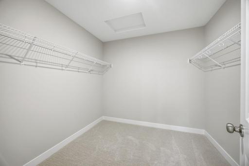 Large walk-in dressing room providing exceptional wardrobe storage.