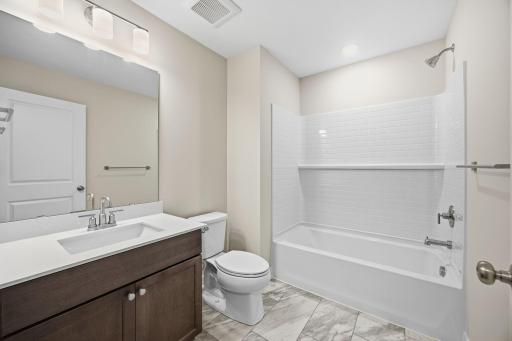 Upper-Level Full Bathroom Serving the Secondary Bedrooms