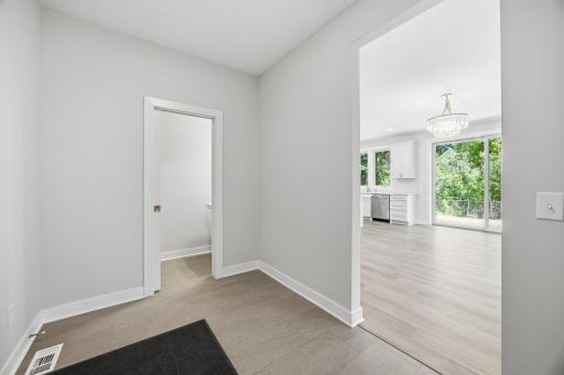 The 10' x 7' mudroom provides a practical transition from the garage and is complemented by a nearby half bath.