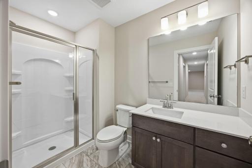 Lower-Level Three-Quarter Bathroom Featuring Modern Finishes