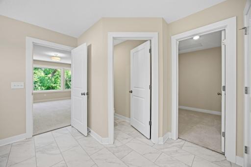 The primary bath provides direct access to the private toilet area and spacious walk-in dressing room.