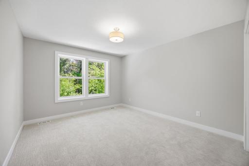 Upper-Level Bedroom #5 Featuring Generous Space and Natural Light