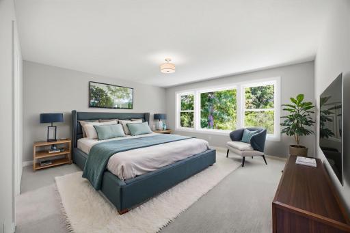 The luxurious primary suite offers a private spa-like bath with a walk-in shower, soaking tub, dual vanities, and 9x8 walk-in dressing room. Professionally Virtually Staged