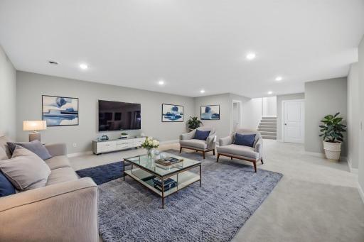The finished lower level features a large family room with plenty of space for entertainment and relaxation. Professionally Virtually Staged.