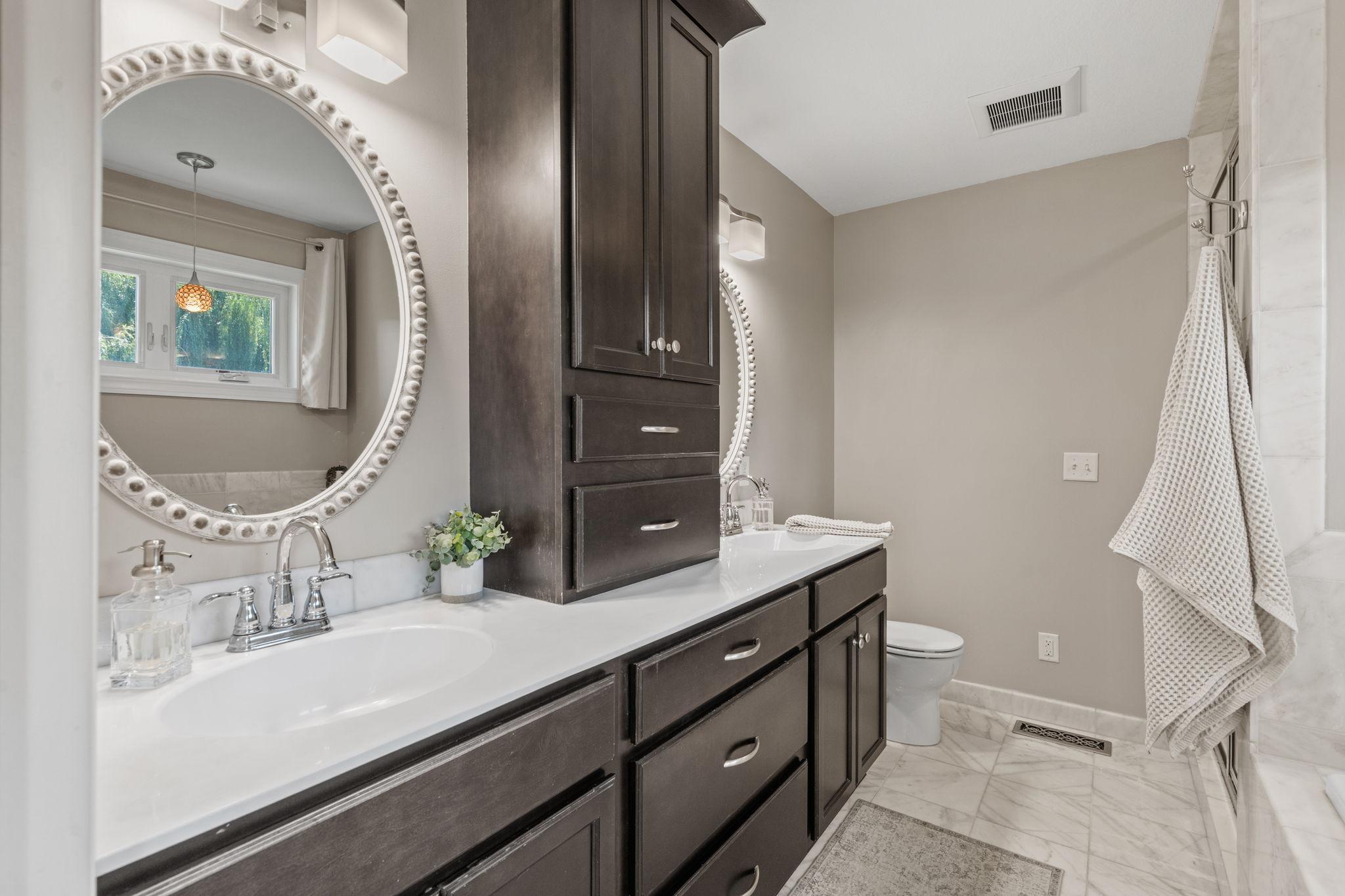Dual vanity with abundant storage.