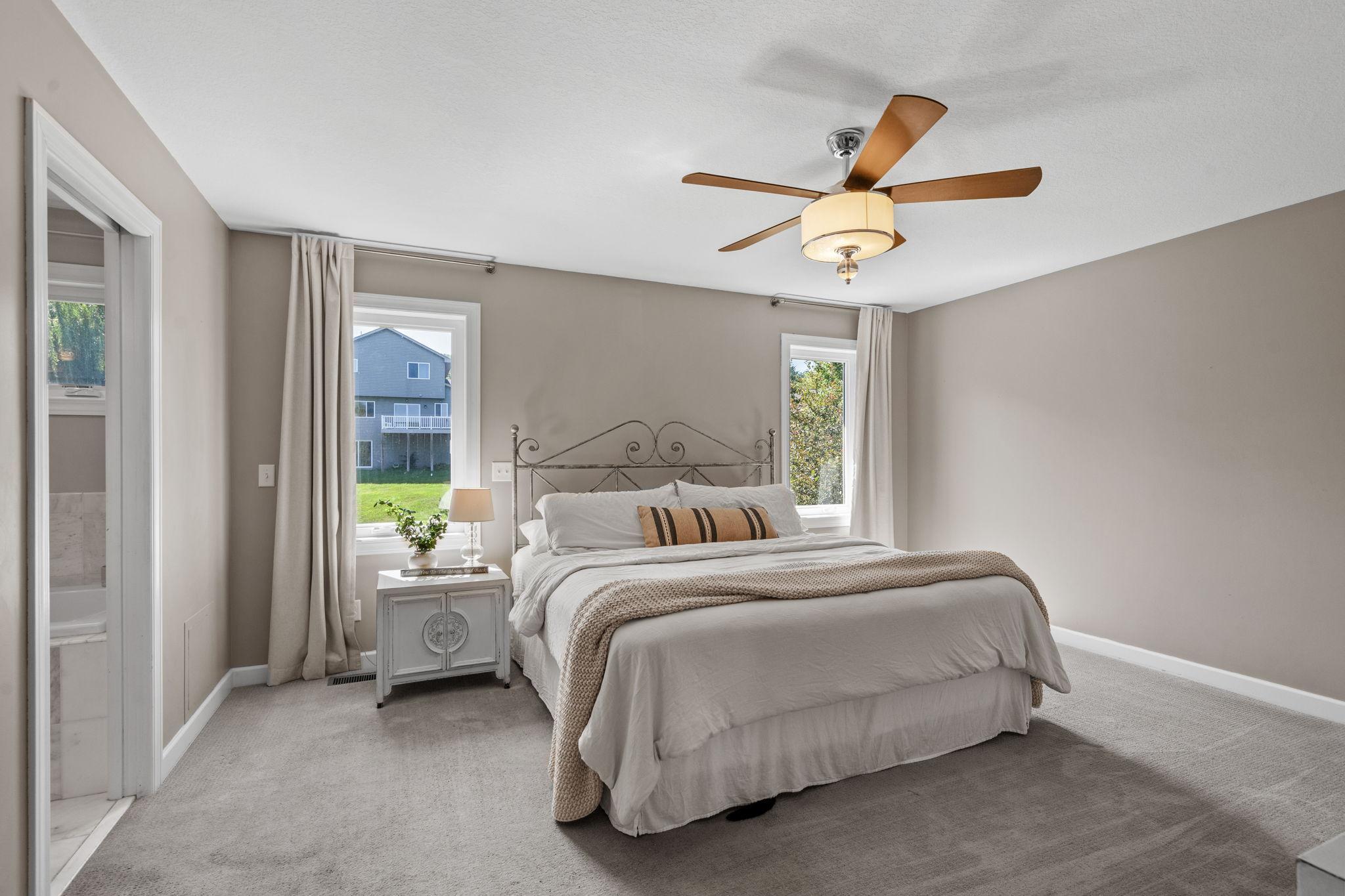 Generous primary bedroom with abundant natural light.