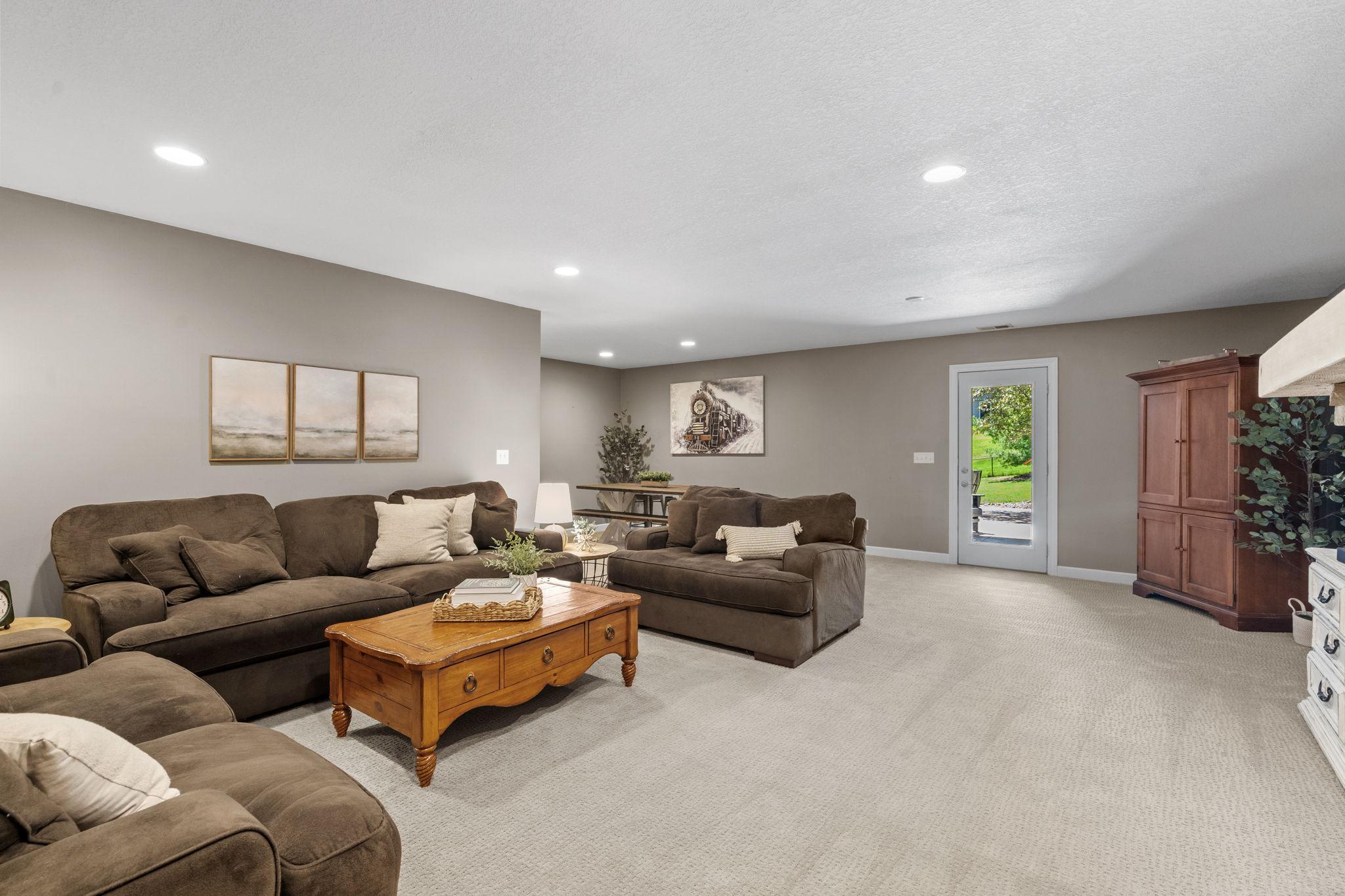 Expansive walkout family room offers endless possibilities for entertaining, relaxing, or movie nights.